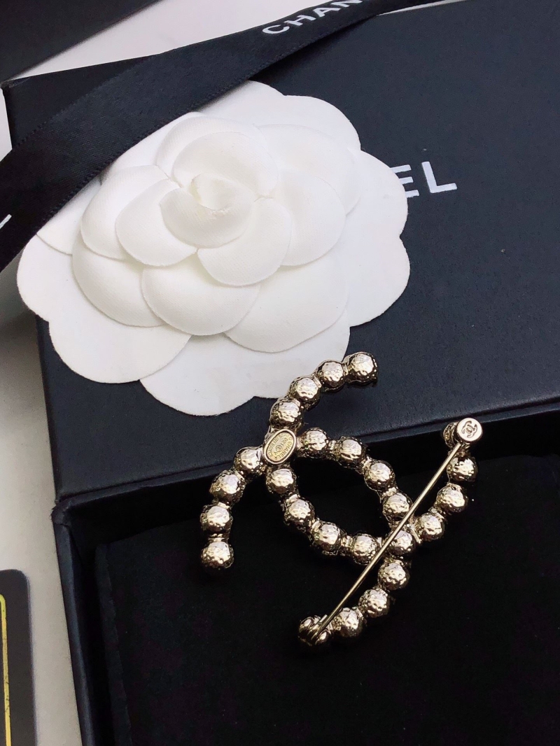 Ch**el brooches